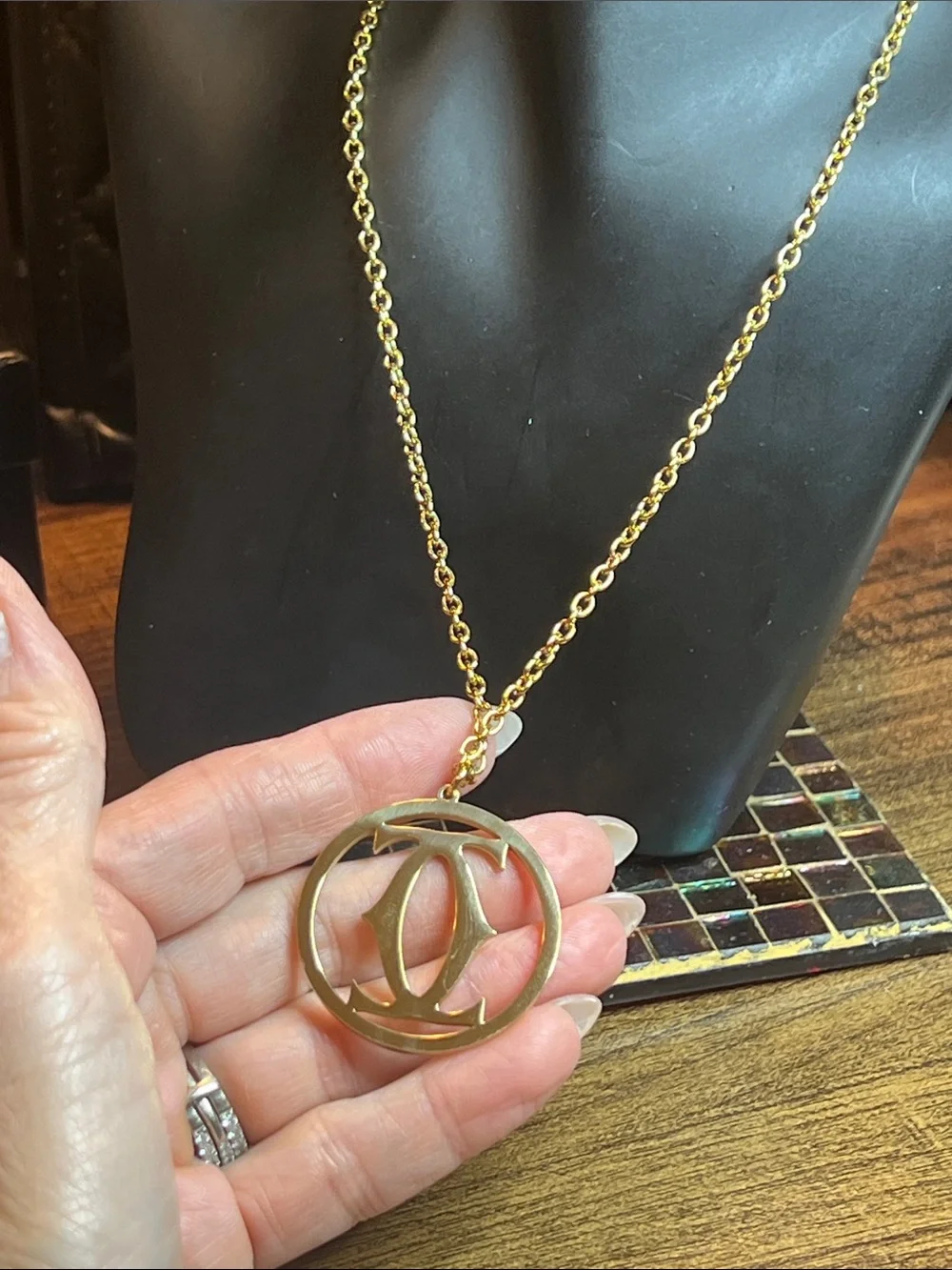 Gold and Black Circular Logo Pendant Necklace
